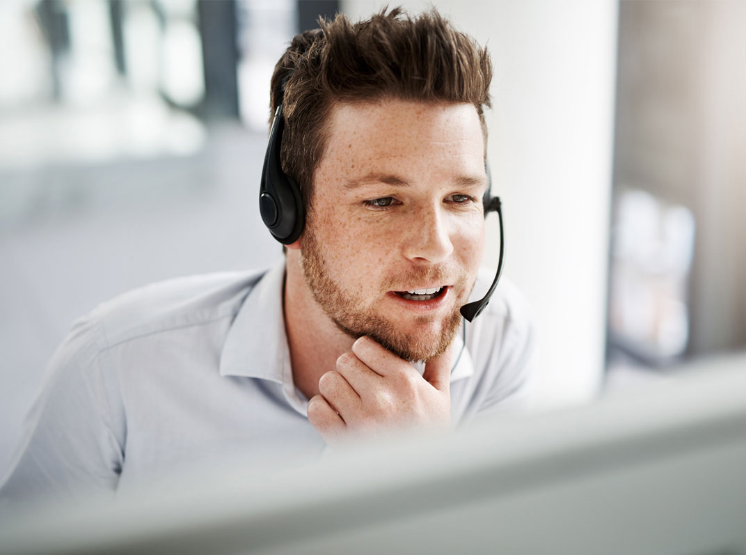 Young man talking to customer on the phone