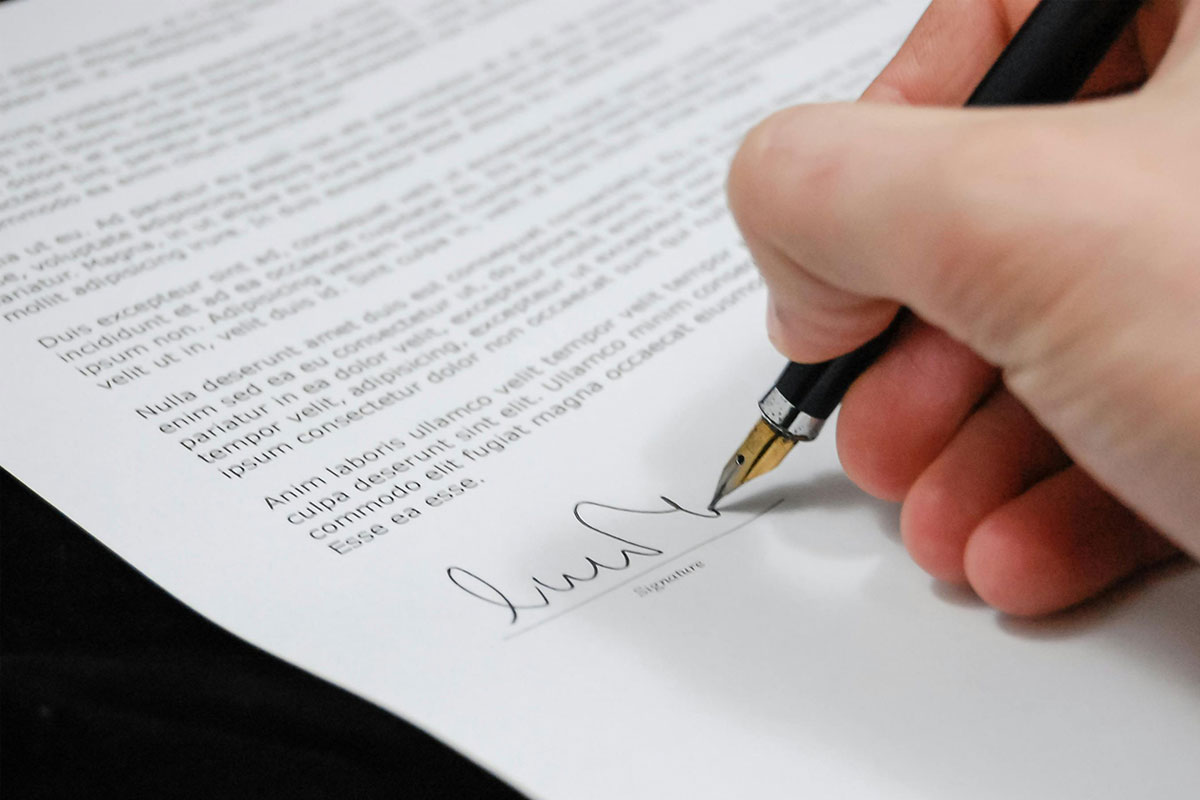 Person signing a contract