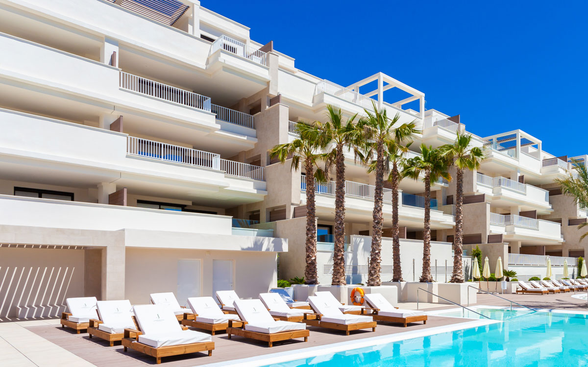Spanish apartment building with a pool