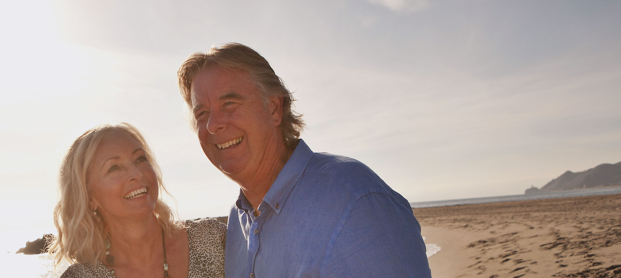 Mature happy couple on a beach