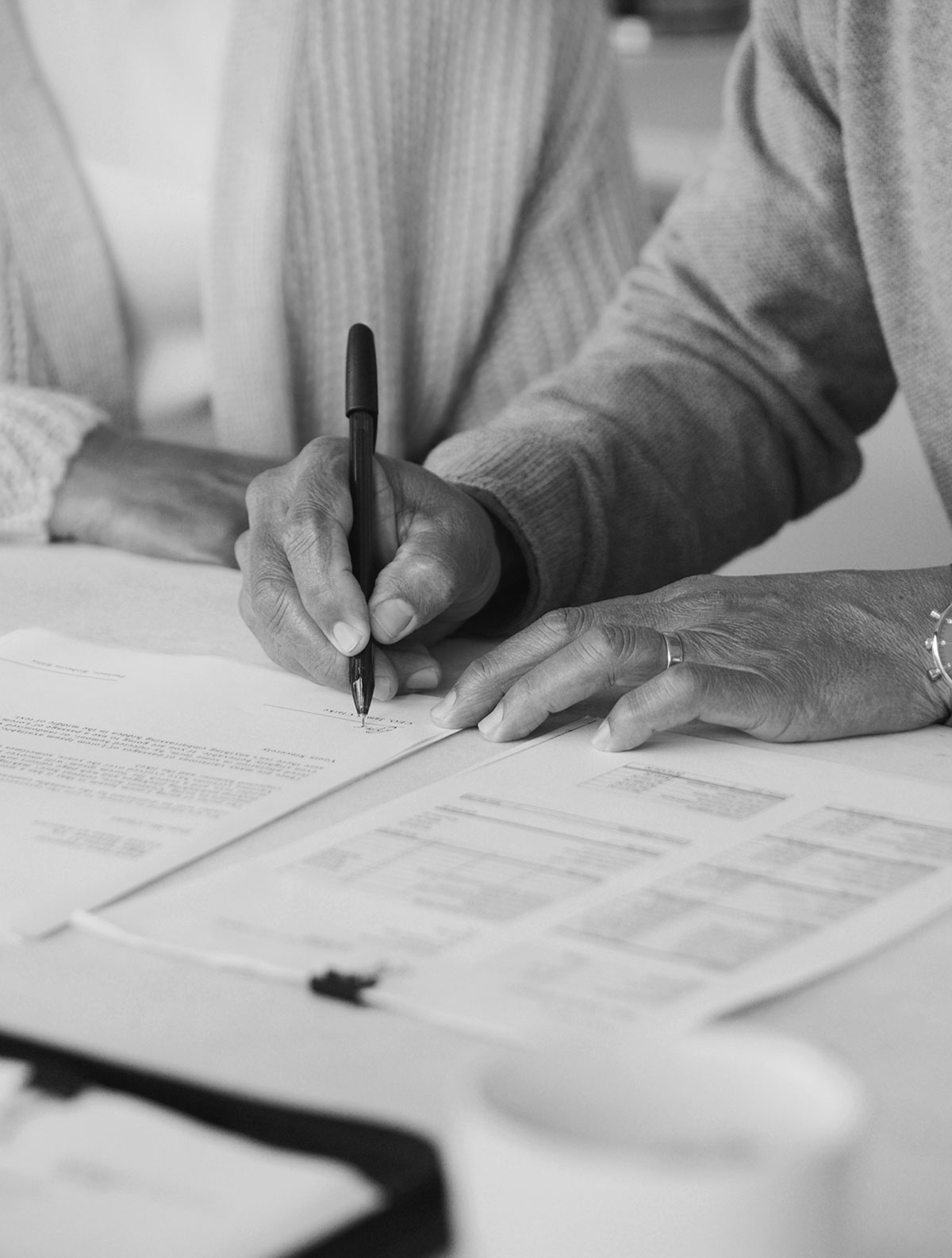 People signing a document