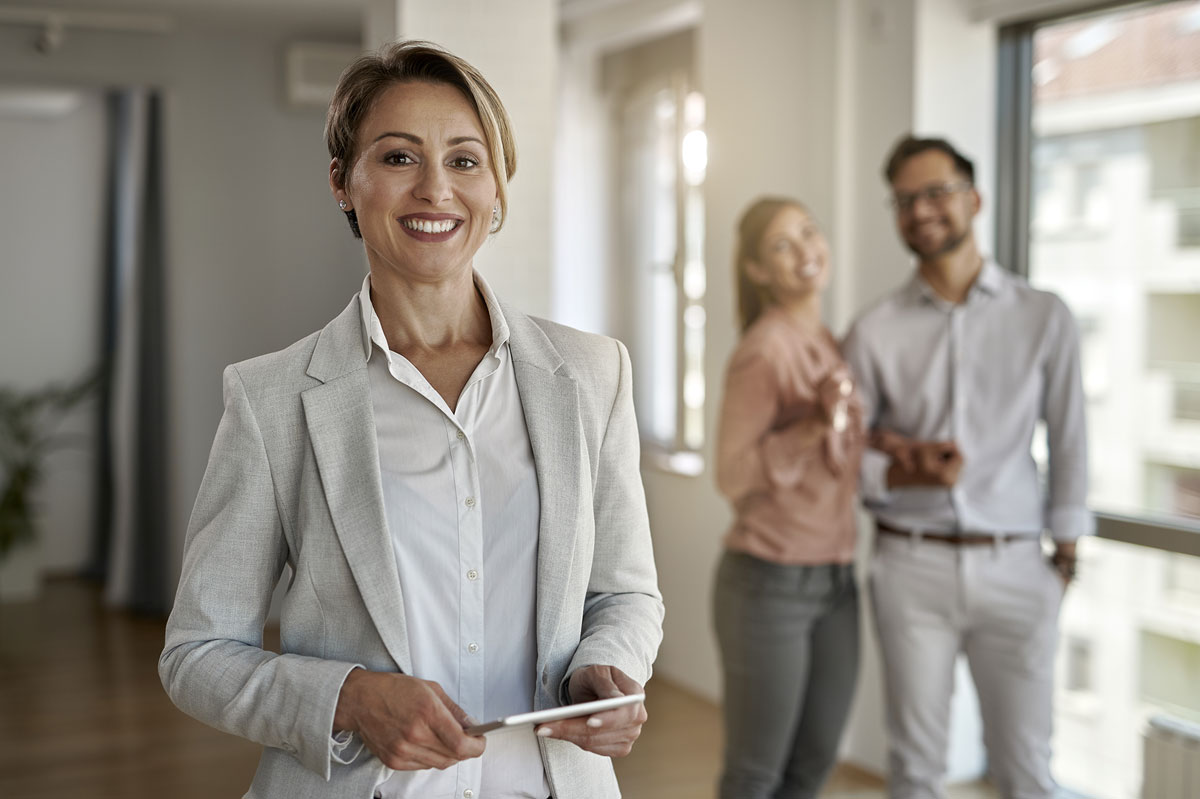 Couple viewing an apartment with a real estate agent